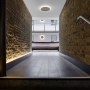 Residential apartment building atrium - Wapping High Street | View from the main entrance staircase into the atrium | Interior Designers